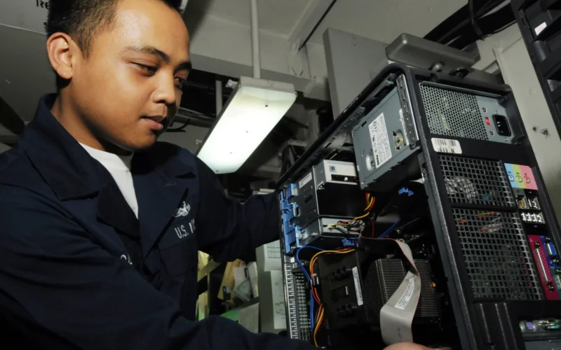 PACIFIC OCEAN (May 30, 2009) Information Systems Technician Seaman Michael Cadiz checks the RAM on a computer in the Automatic Data Processing shop aboard the aircraft carrier USS George Washington (CVN 73). George Washington, the Navy's only permanently forward deployed aircraft carrier, is underway conducting a Combat Operations Efficiency evaluation in the western Pacific Ocean.