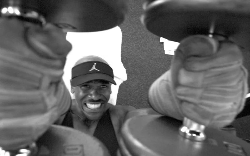 Pearl Harbor, Hawaii (May 14, 2003) -- Aviation Maintenance Administrationman 2nd Class George F. Stowe III, assigned to the “Wizards” of Patrol Squadron Special Projects Two (VP-2), lifts dumbbells together during a workout session. Stove is a certified personal fitness trainer and also assists the command fitness coordinator in his squadron. VP-2 had a 100 percent success rate during a recent physical readiness test. U.S. Navy photo by Photographer's Mate 1st Class William R. Goodwin. (RELEASED)