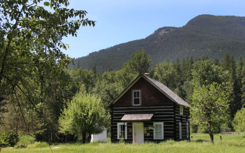 The Bull River Guard Station was built in 1908 as the Ranger's house and office. This structure was a primary ranger station from 1908 to 1920, surviving the 1910 fire. The cabin was home to Granville "Granny" Gordon (District Ranger), his wife and three daughters. When the 1910 fires roared thru the country, Mrs. Gordon prepared for the worst by soaking gunny sacks in a tub of water. If they had to escape the fire, they would wrap themselves in the gunny sacks and race to the Bull River to wait out the fire. As the fire closed in on the ranger station, it shifted direction and swept up Pilik ridge sparing their home. The cabin is a two story building, containing 700 square feet. It is equipped with period furniture including three full beds and two single beds including mattresses. It has a sitting room with chairs, a kitchen / dining room with a hutch, table and chairs, and electric range. It is heated with a forced air electric furnace, and contains cleaning supplies. The cabin is not plumbed for water and has an outdoor toilet. In the winter the cabin is normally plowed within 1 mile. The cabin can be reserved 3 days in advance of your stay by contacting the Ranger Station or Contact the National Recreation Reservation Service at 1-877-444-6777 or www.recreation.gov, the cabin can be reserved 180 days in advance of your stay.