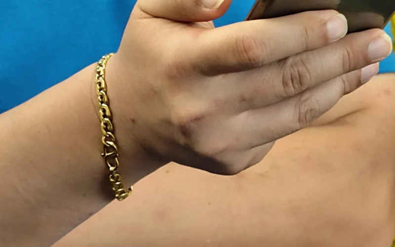 HK blue male uniform Linde Group n close up hand holding smartphone in September 2025