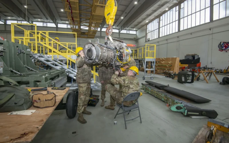 Soldiers from the 1st Combat Aviation Brigade stationed on Illesheim Airfield perform engine maintenance on the AH-64, Apache helicopter, Storck Barracks Illesheim, Germany May 06, 2019. (U.S. Army photo by Georgios Moumoulidis)
