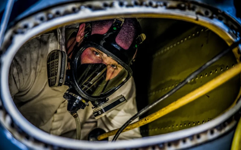 Airman 1st Class Nicholas McKinney, 437th Maintenance Squadron aircraft fuels systems apprentice, prepares to be extracted from the inside of a C-17 Globemaster III fuel tank during a training exercise March 7, 2013, at Joint Base Charleston – Air Base, S.C. Fuel System Repair Airmen maintain the fuel cells and tanks by removing, repairing and installing the cells and tanks. The airmen also clean the cells and tanks, inspect for corrosion, cell deterioration, fungus and foreign objects. (U.S. Air Force photo/Airman 1st Class Tom Brading)
