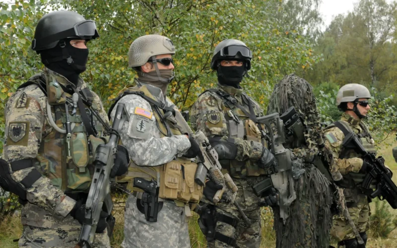 Special Operations Forces operators representing Croatia (first and third from left), the U.S. (second from left) and Poland (first and second from right), wear a variety of gear on Sept. 20 at Drawksow Pomorskie, Poland during a press conference as part of the official start of the Jackal Stone 10 exercise. Jackal Stone 10, hosted by Poland and Lithuania this year, is an annual international special operations forces (SOF) exercise held in Europe. Its objective is to enhance capabilities and interoperability amongst the participating special operations forces and as well as build mutual respect while sharing doctrinal concepts. The exercise, which is coordinated with U.S. Special Operations Command Europe, includes countries from Poland, Lithuania, Latvia, Croatia, Romania, and Ukraine participating in the exercise. (U.S. Army photo by Master Sgt. Donald Sparks)