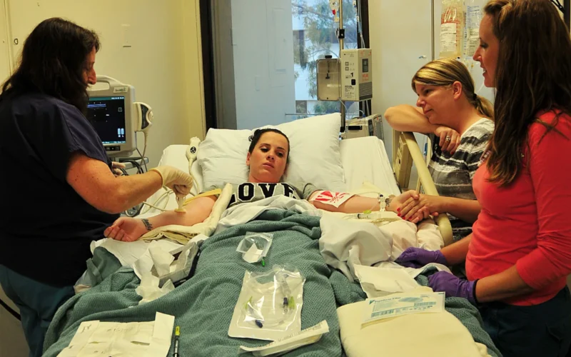 LA JOLLA, Calif. (April 5, 2011) A registered nurse at Scripps Green Hospital in La Jolla, Calif., uses an ultrasound device to locate a vein in the arm of Ship's Serviceman Seaman Brittany Barr before a blood stem cell donation to benefit a patient diagnosed with myelodysplastic syndrome. Barr, assigned to Fleet and Industrial Supply Center (FISC) San Diego, agreed to donate her cells to the same patient she previously donated bone marrow to in 2008 through the Department of Defense Marrow Donor Center. (U.S. Navy photo by Candice Villarreal/Released)