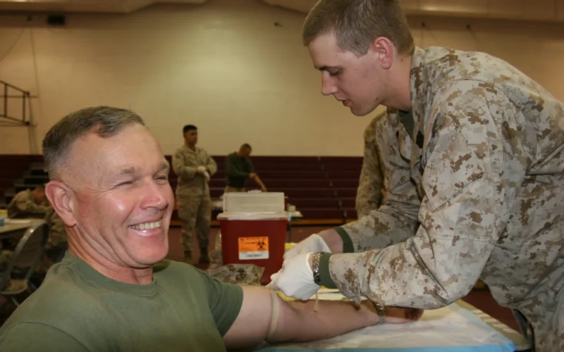 The Marine Corps Air Ground Combat Center Commanding General, Brig. Gen Richard C. Zilmer, shows registering to be a bone marrow donor is painless and hassle free. Zilmer is one of nearly 3,000 Combat Center Marines, Sailors, family members and civilian employees who took time to register as donors Feb. 28 and March 1 at a Combat Center registration drive.