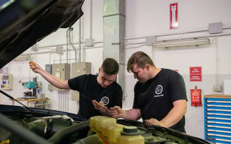 Senior Airman Brenden Lewandowski (left), a maintainer with the 914th Logistics Readiness Squadron, works with Senior Airman Alex Chastain (right), a vehicle mechanic at the vehicle maintenance shop on Aviano Air base, Italy, to perform a preventative maintenance inspection (PMI) on a Ford F-350 on May 10, 2023. PMI's are done daily on military owned vehicles to keep them in working condition, so they may be utilized in the field during training exercises and daily operations. (U.S. Air Force photo by Airman 1st Class Kylar Vermeulen) prepares to do an oil change by putting on required personal protective equipment at the vehicle maintenance shop on Aviano Air Base, Italy, May 10, 2023. Lewandowski is assigned to the vehicle maintenance flight at Niagara Falls Air Reserve Station with the LRS squadron, whose members are currently supporting Operation Swift Response, one of three operations that fall under Defender '23. (U.S. Air Force Photo by Airman 1st Class Kylar Vermeulen)