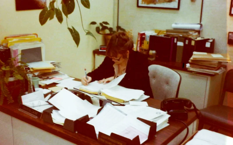 Sharon Caine, U.S. Army Corps of Engineers Sacramento District real estate division chief, is pictured working at her desk in the 1980s when she was a section chief in the real estate branch. Caine will retire at the end of 2014 after serving the U.S. Army Corps of Engineers for 54 years. Most of that time was spent with the Corps’ Sacramento District. (U.S. Army photo provided by Sharon Caine/released)