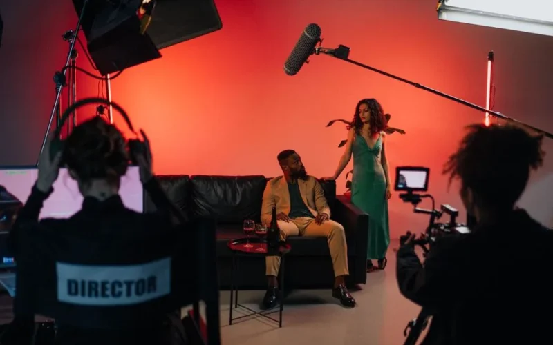 A dynamic film set with actors and crew actively engaged in a studio environment.