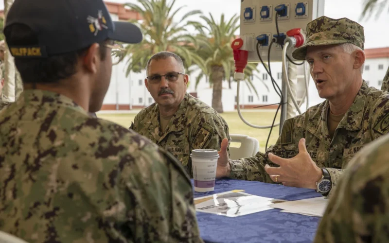 NAVAL STATION ROTA, Spain (May 6, 2024) – Rear Adm. Wayne “Mouse” Baze, commander of Navy Personnel Command, speaks to an undesignated Sailor, who enlisted through the Professional Apprenticeship Career Track (PACT) program, during a MyNavyHR Career Development Symposium event at Naval Station Rota, May 6, 2024. Hosted by Navy Personnel Command, the symposium equipped Sailors with knowledge about career benefits and opportunities and also provided the opportunity to speak directly with leaders, detailers, community managers, and program representatives. (U.S. Navy photo by Chief Mass Communication Specialist Zachary Anderson)