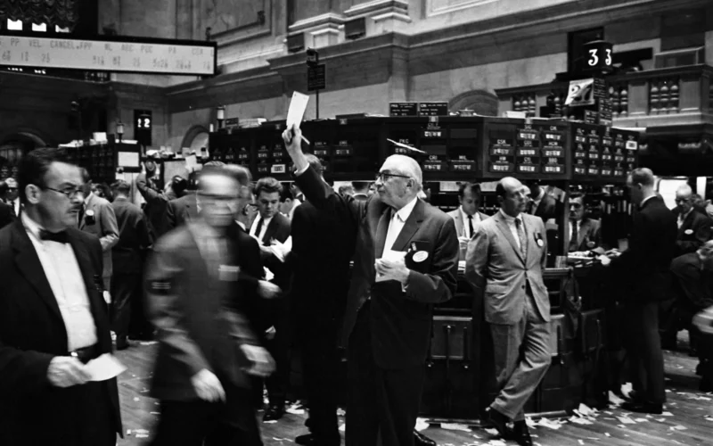 Photograph shows stock brokers working at the New York Stock Exchange