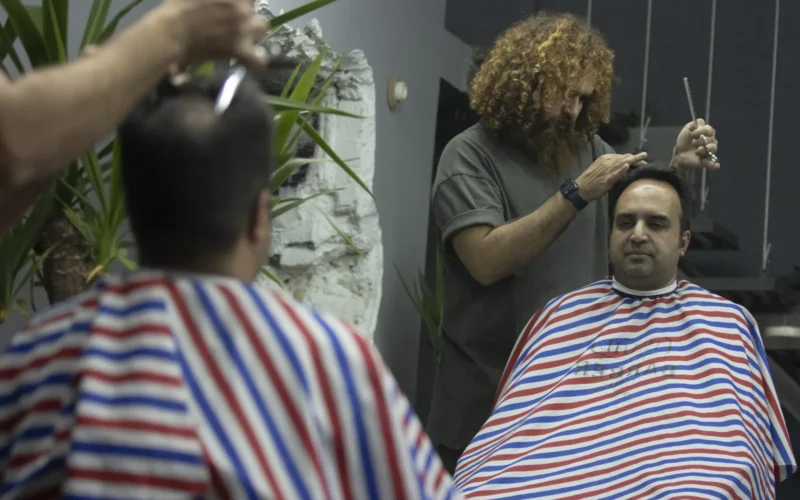 A hairdresser is a person whose occupation is to cut or style hair in order to change or maintain a person's image. This is achieved using a combination of hair coloring, haircutting, and hair texturing techniques. Examples of professional titles in Canada include 'barber,' 'hairstylist,' 'hair colour technician,' 'hairdresser, and 'wig stylist.' Each professional title also has an 'apprentice' version.
