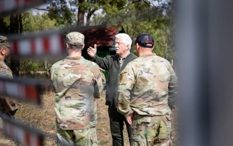 Piotr Karpiński, the Marshal representative for The Polish Hunting Association, gives a tour around the ranges to the leadership of the forward operating site (FOS) at Torun, Poland, April 7, 2022. The purpose of the visit was for the FOS leaders to know the surroundings of the shooting range in the same community as the training area and enhance the relationship with the local community. (U.S. Army National Guard Photo by Staff Sgt. Gabriel Rivera)