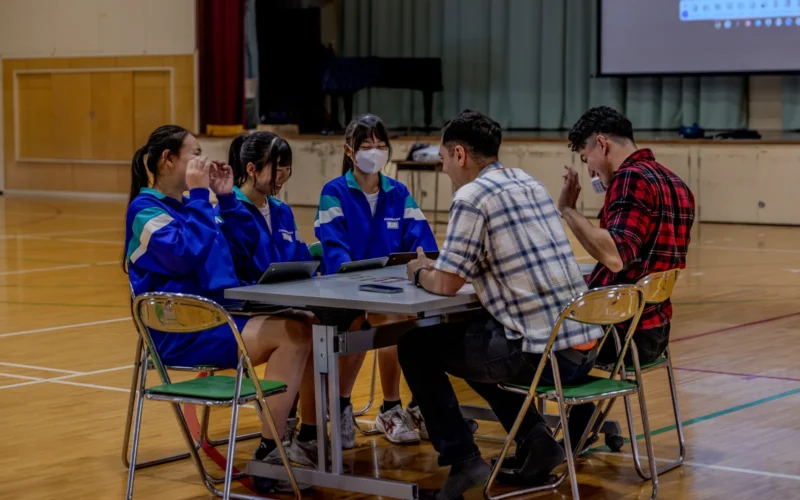 Students from Higashi Junior High School practice their English conversation skills with Soldiers from Camp Zama during English Challenge Day, Mar. 14, 2025, in Zama City, Japan. These one-on-one interactions help students build confidence in speaking English while fostering friendship between the U.S. Army and local community. (U.S. Army photo by Staff Sgt. Connor Davis)
