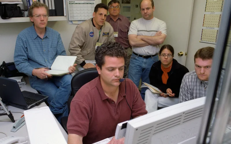 EC99-45110-1 Proteus DSA control room in Mojave, CA L to R Jean-Pierre Soucy; Amphitech International Software engineer Craig Bomben; NASA Dryden Test Pilot Pete Siebold; with headset, at computer controls Scaled Composites pilot Bob Roehm; New Mexico State University NMSU UAV Technical Analysis Application Center TAAC Chuck Coleman; Scaled Composites Pilot Kari Sortland; NMSU TAAC Russell Wolfe; Modern Technology Solutions, Inc. Scaled Composites' unique tandem-wing Proteus was the testbed for a series of UAV collision-avoidance flight demonstrations. An Amphitech 35GHz radar unit installed below Proteus' nose was the primary sensor for the Detect, See and Avoid tests. April 3, 2003 NASA Photo / Tom TschidaProteus Project Description NASA Identifier: 334543main_EC03-0089-1