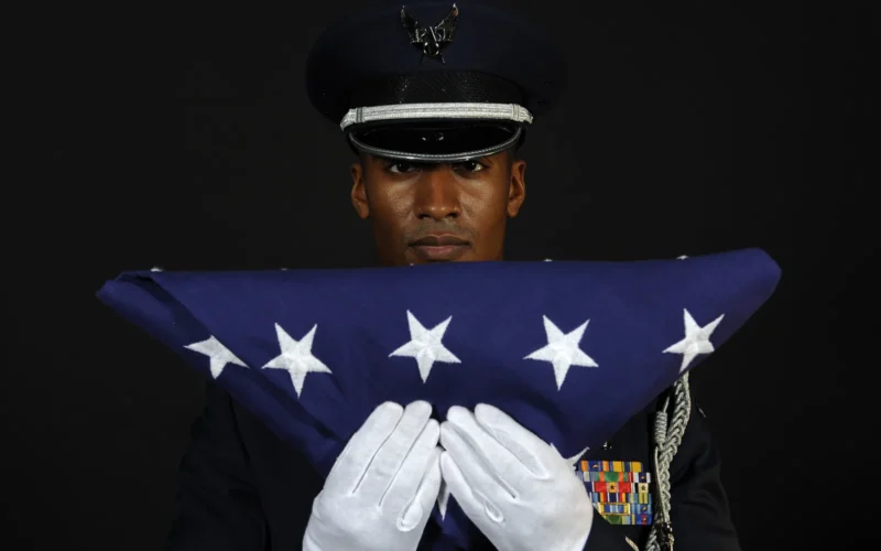 Capt. Bishane Whitmore, Ellsworth AFB Honor Guard officer in charge, stands at attention after completing the flag dressing sequence, June 24. The Base Honor Guard's primary mission is to represent Ellsworth and the Air Force at public and official ceremonies. 28th Bomb Wing Public Affairs Photo by Senior Airman Marc Lane Date: 06.24.2010 Location: Ellsworth AFB, US Related Photos: dvidshub.net/r/r2xcxp