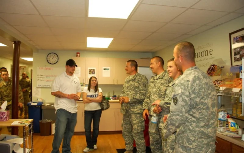 Indianapolis Colts linebacker Pat Angerer and wife Mary take time to visit troops at Camp Atterbury through the support of the USO of Indiana June 3. Many of the service members he met here are preparing for missions overseas to Afghanistan or Iraq. During his visit he had the opportunity to meet with members of the Kentucky Army National Guard preparing to deploy. These Soldiers are with the 1149th Forward Support Company, 149th Maneuver Enhancement Brigade, located in London, Ky. Pat signed autographs and spent time with Soldiers in the Camp Atterbury USO. Kentucky Guardsman included here are Pfc. David Ostering, Spc. Adam Patterson, Spc. Randy Levan and Spc. Eddie Schwartzkopf. All the Kentucky Soldiers are from London, Ky. Pat and his wife recently signed up as volunteers for USO. "I had people take time out of their day to show me and my wife Camp Atterbury," said Pat. "They have treated me so well. I was able to meet so many good people. It's been a very, very positive trip and I look forward to coming back." Pat and Mary's hometown is in Bettendorf, Iowa, however, they currently reside in Brownsburg, Ind.