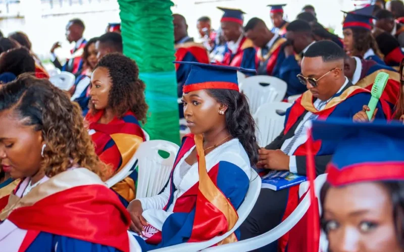 Students in caps and gowns attending a graduation ceremony, showcasing diversity and education.