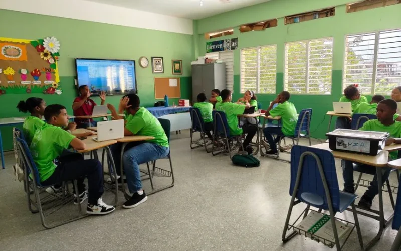 Students in a colorful classroom engaging with technology and instruction. Bright and collaborative learning environment.