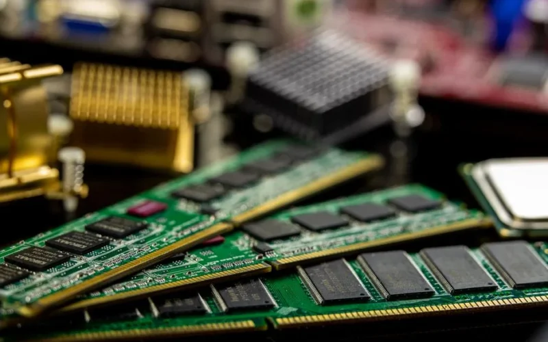 Detailed view of RAM sticks and microprocessors on a motherboard.