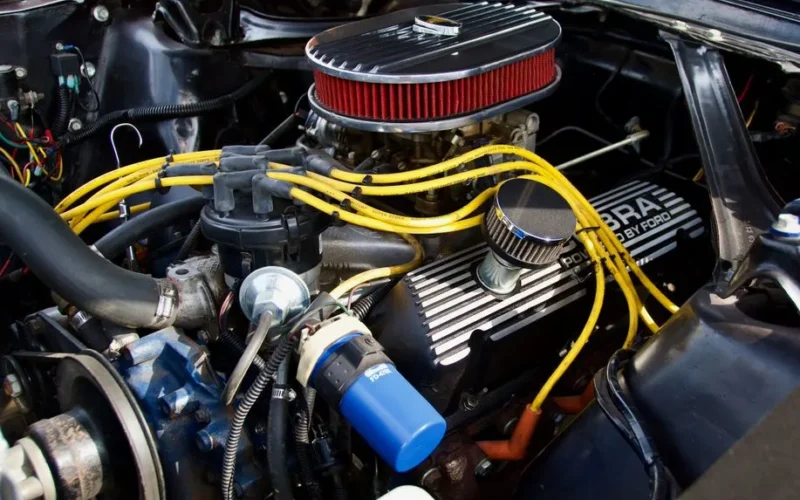 Detailed close-up of a Ford engine showcasing components and vibrant wiring.
