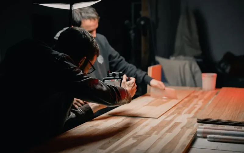 Two photographers working on a creative studio photoshoot.
