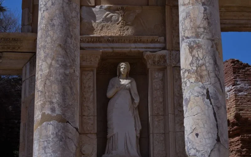 Detailed view of an ancient statue surrounded by columns in Ephesus, İzmir, Turkey.